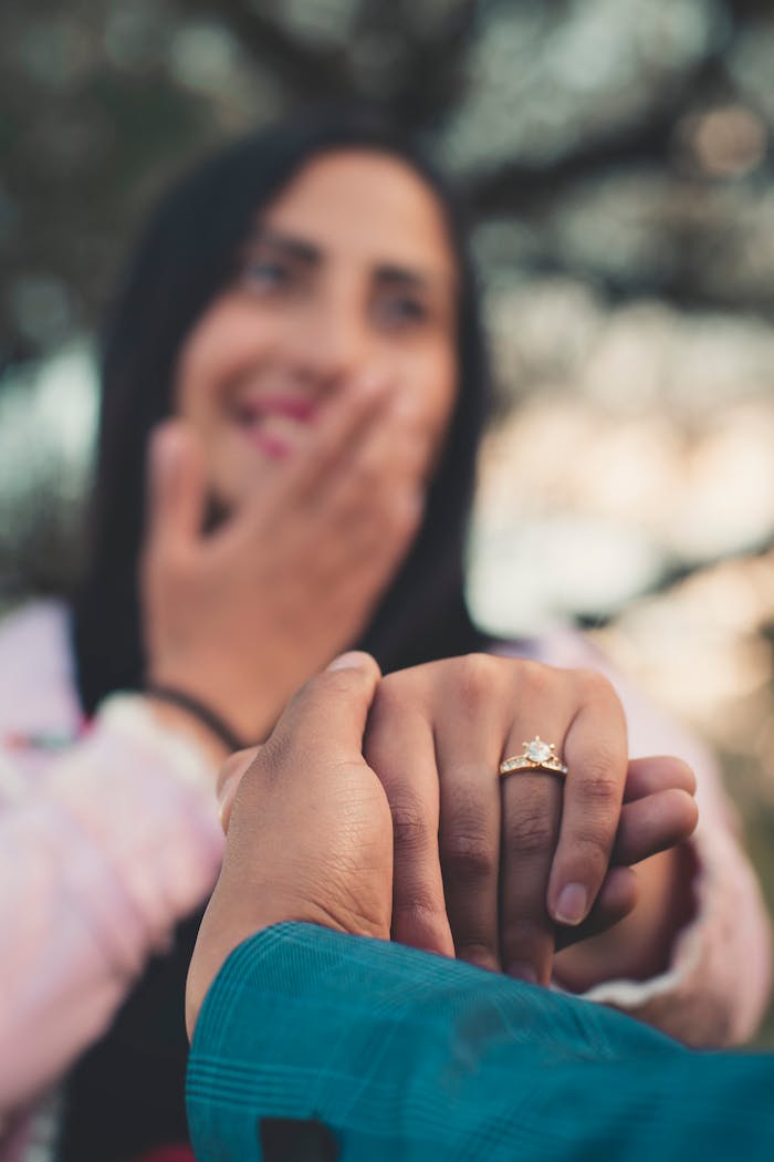 pexels-photo-2894866 A joyful couple during a romantic outdoor engagement proposal.